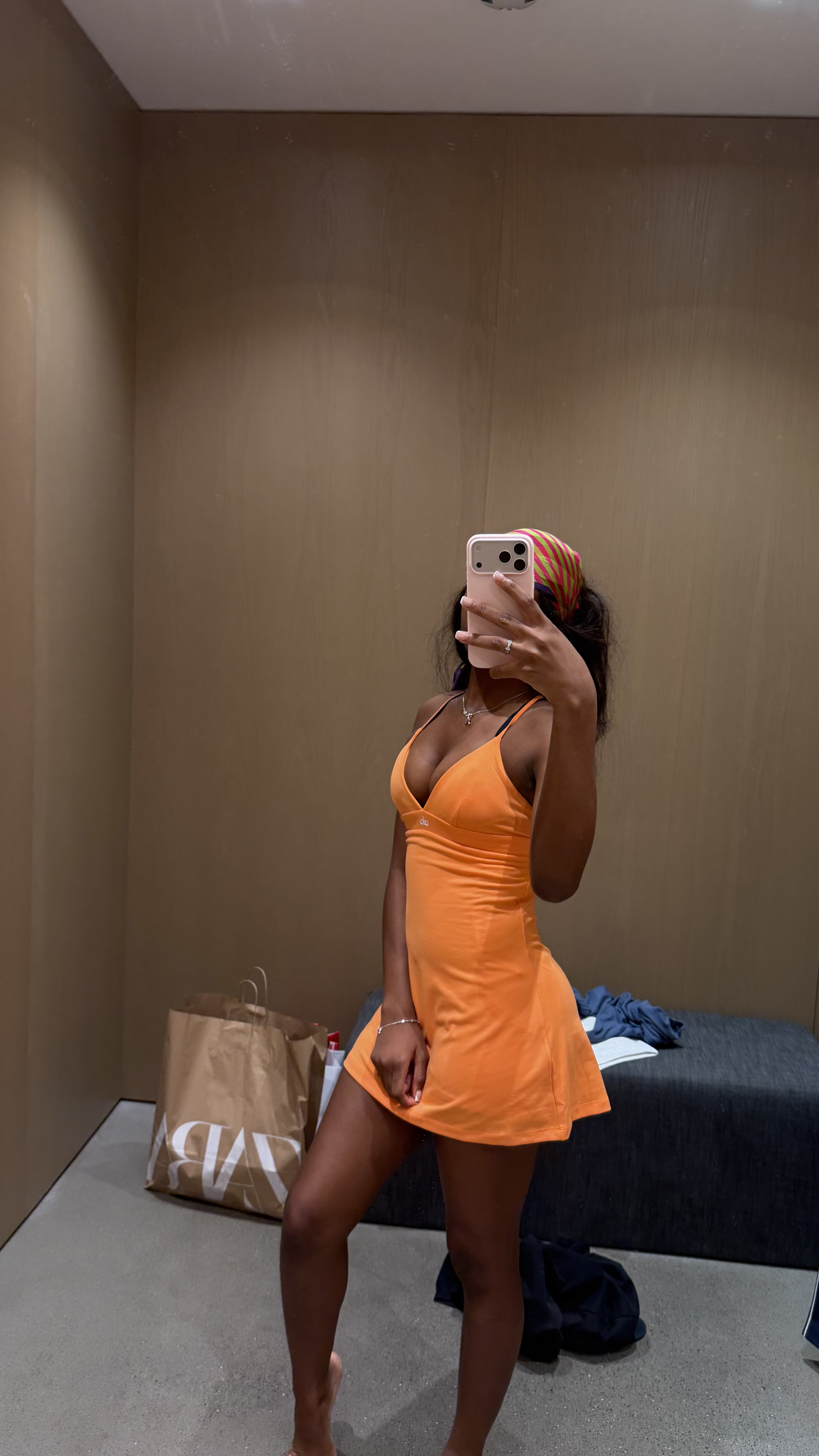 black and white ski bag with orange dress inside